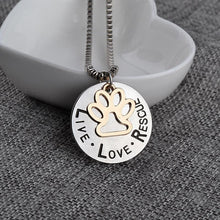Load image into Gallery viewer, &quot;LIVE LOVE RESCUE&quot; Paw Silver Pendant Necklace
